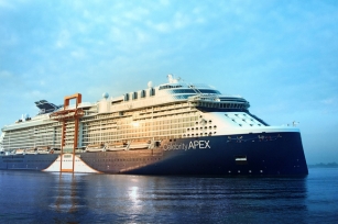 close up image of Celebrity Apex cruise ship featuring the blue skies and deep blue waters