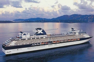 Aerial view of the Celebrity Constellation  cruise ship featuring the cloudy skies and deep blue waters
