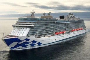 image of the Discovery Princess cruise ship gliding through the waters against the cloudy skies