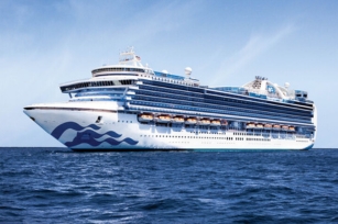 image of the Emerald Princess cruise ship featuring the blue skies and deep blue waters