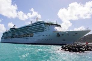 close up image of the Jewel of the Seas docked onto the port featuring the blue water