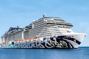 close up image of the MSC Euribia featuring the calm sea and clear waters. The Cruise ship is unique with it's colourful base