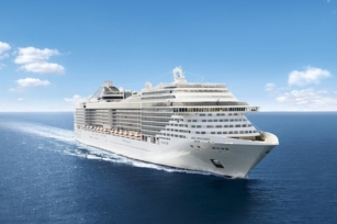 frontal image of  MSC Splendida on a clear sky cruising along the blue waters