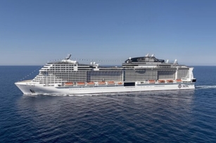 side image of the MSC Virtuosa cruise ship on a sunny day cruising through blue waters