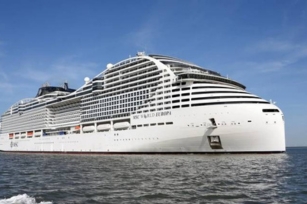 image of the MSC World Europa cruise ship from seashore level on a sunny day 
