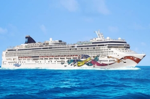 image of Norwegian Jewel cruise ship  cruising through the deep blue waters
