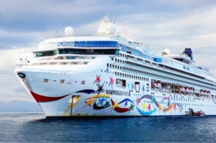 Image of the Norwegian Star from the front surrounded by clouds