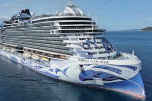 close image of Norwegian Viva cruise ship surrounded by clear blue waters and clear skies