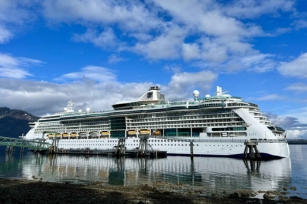 Close up of the Radiance of the Seas featuring the blue skies filled with clouds